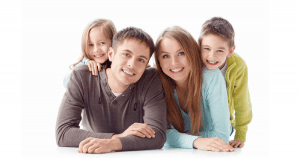 happy, smiling family wondering How Does Sugar Affect Your Teeth