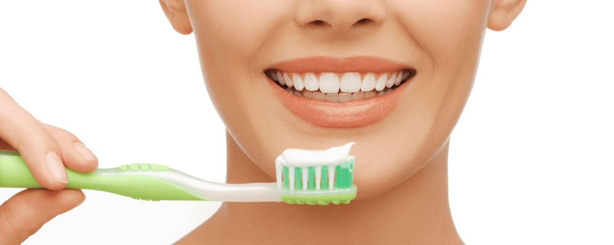 woman with toothbrush - How Your Dental Health Affects Your Overall Health