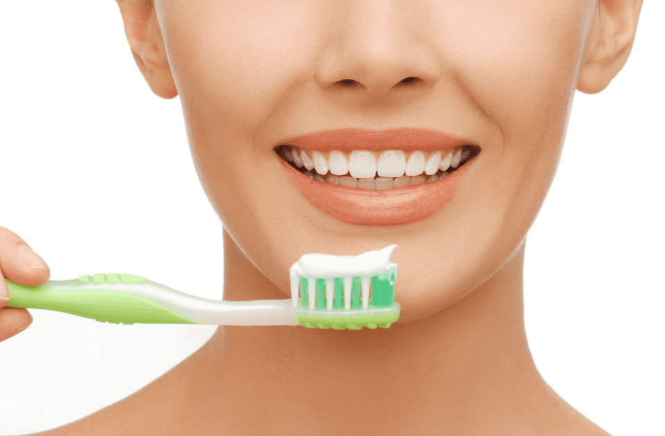 woman with toothbrush - How Your Dental Health Affects Your Overall Health