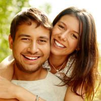 What are the benefits of straight teeth? - smiling man and woman