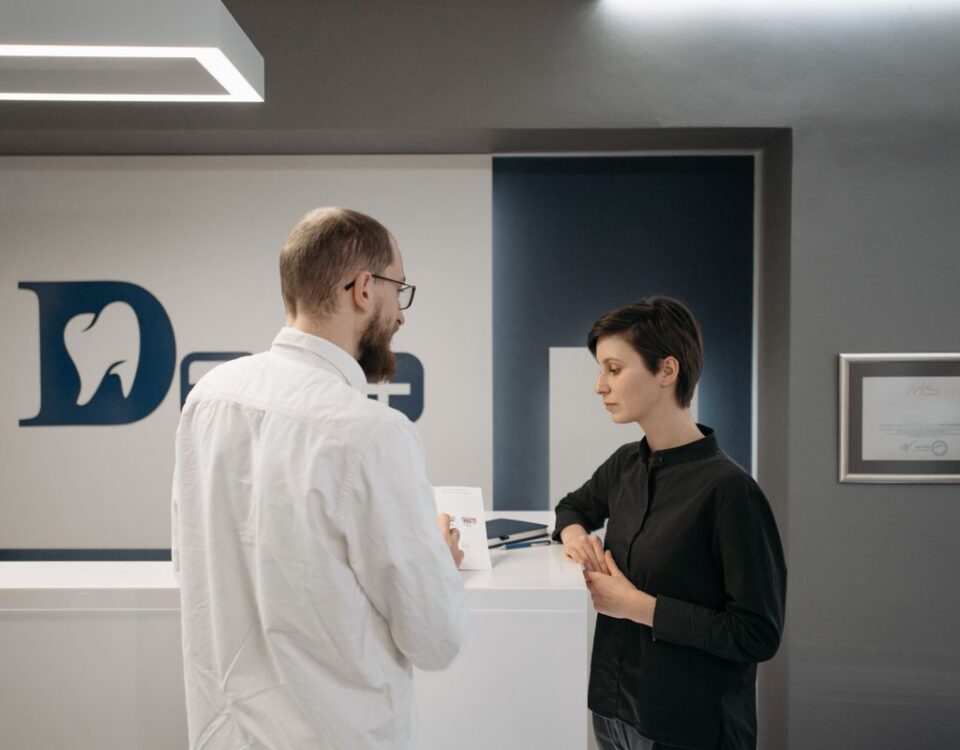 Dentist consulting with a patient about a chipped tooth