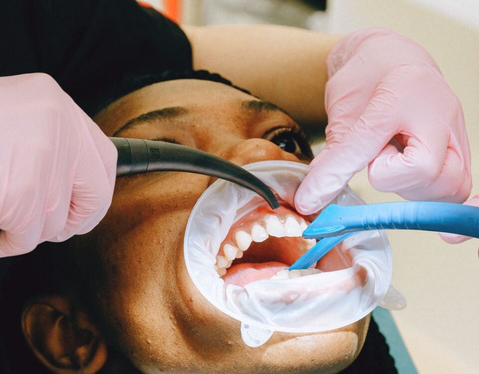 Dental professional performing a professional teeth cleaning