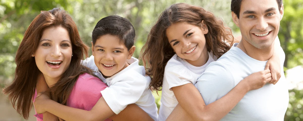 Difference between Orthodontist and Dentist - smiling happy family