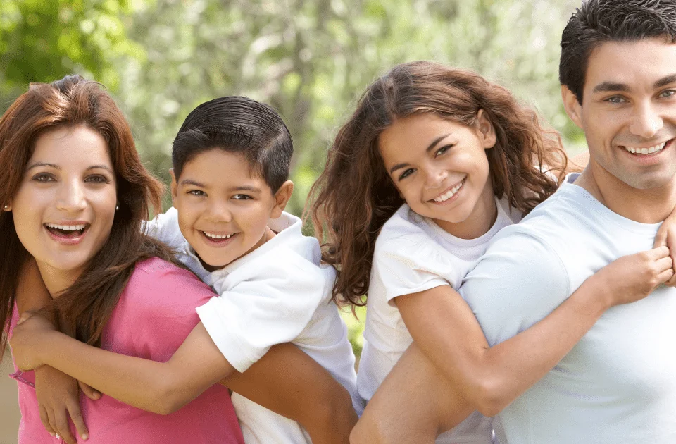 Difference between Orthodontist and Dentist - smiling happy family